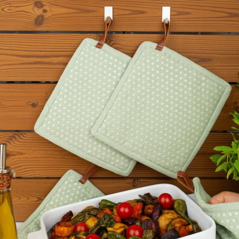 Grytlapp salviagrön med ficka och siliconprickar 